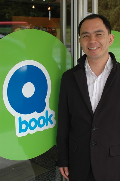 Yoji Kimura at the entrance to the new Qbook booking information centre med res